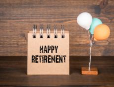 Notebook that says Happy Retirement by small balloons